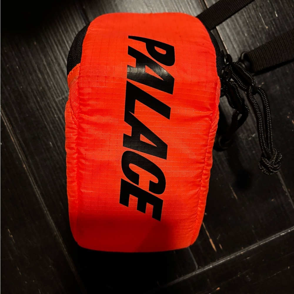 PALACE Vibrant orange and black sling sack